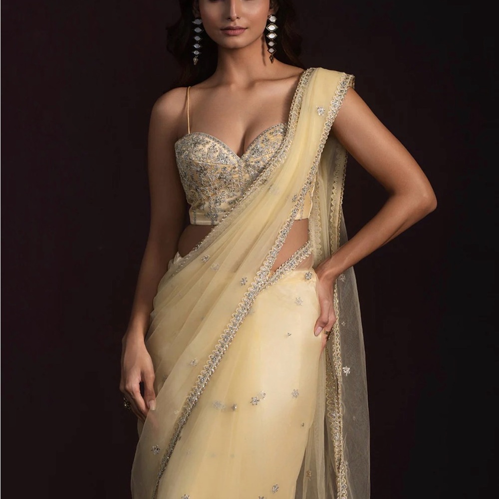 Elegant Cream Saree with Embellished Blouse
